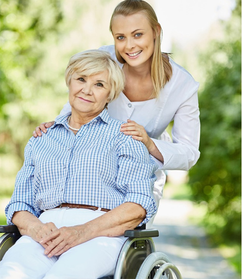 Caregiver assisting a resident in a garden