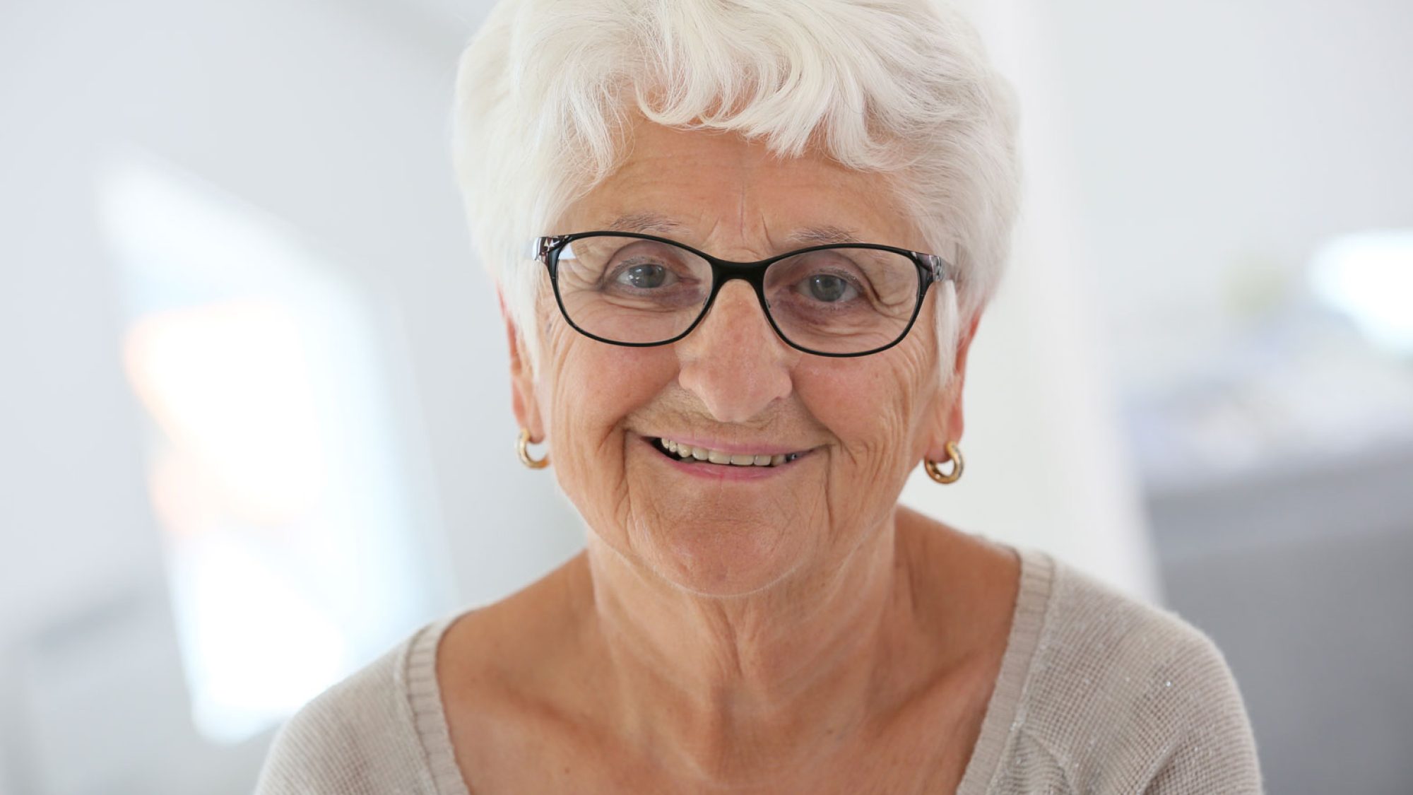 Smiling senior woman wearing glasses