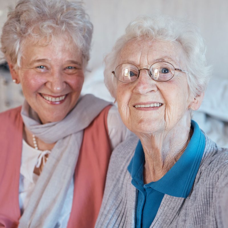 Happy residents smiling together indoors
