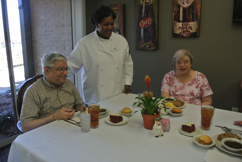 Residents enjoying a meal in the dining area