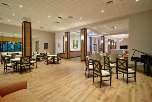 Dining area with tables and chairs.
