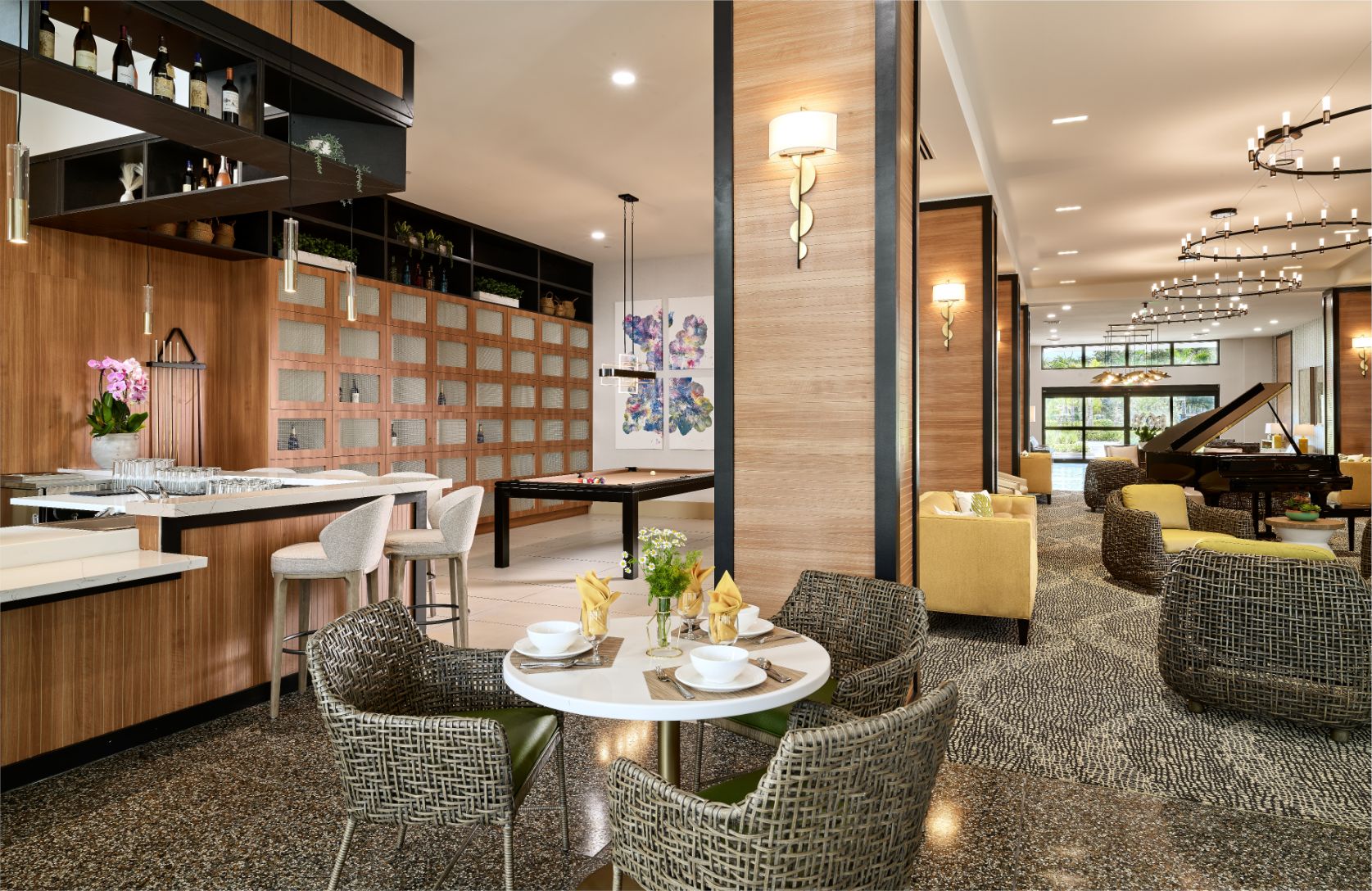 Dining area with tables and chairs in a modern setting.