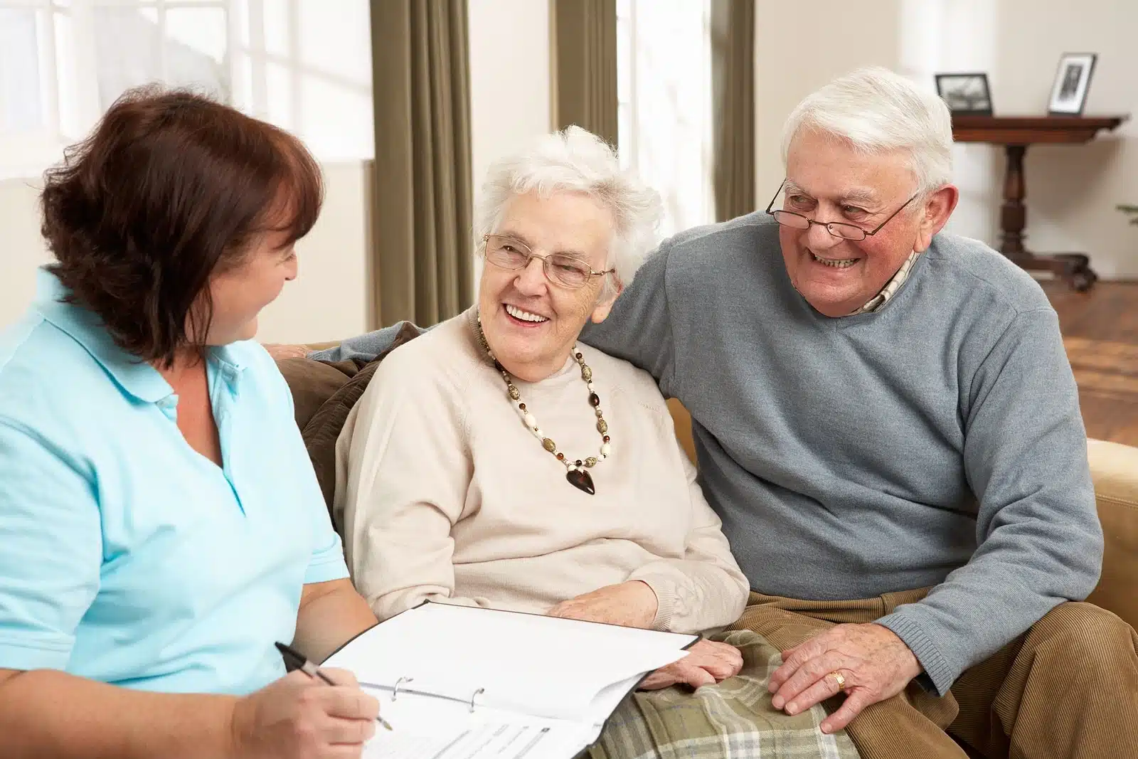 A caregiver interacting with elderly residents.
