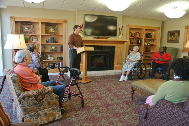 Residents engaged in a group activity in the common area.
