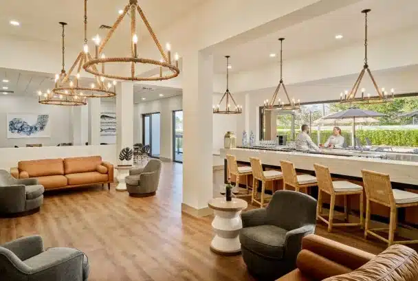 Bright, modern common area with residents interacting.