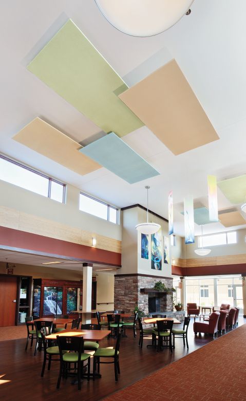 Common area with seating and decorative ceiling panels.