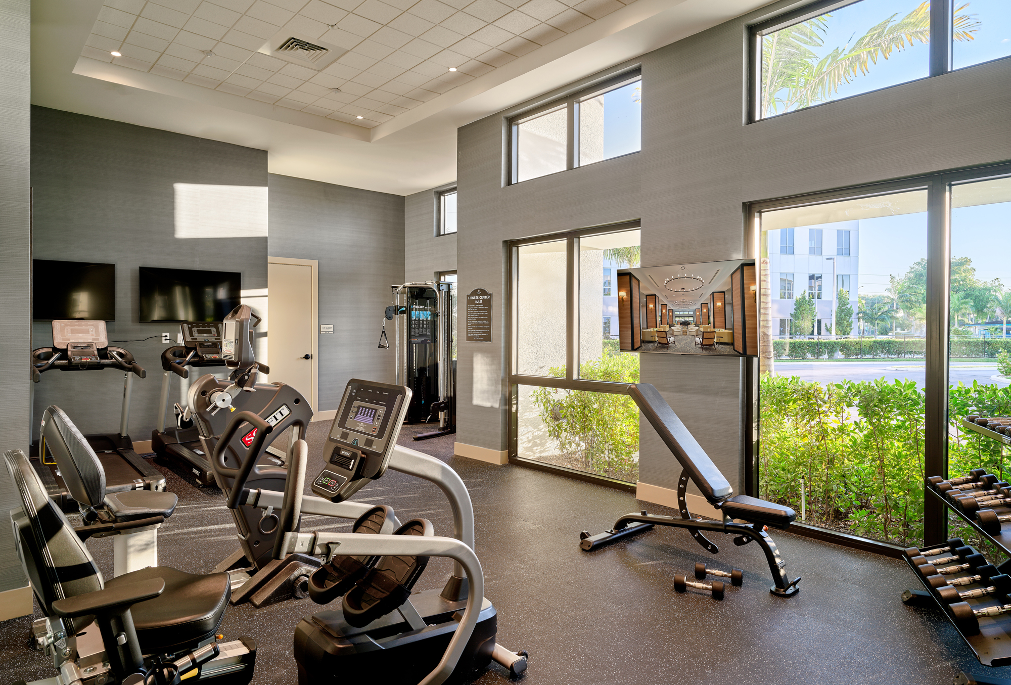 Well-equipped fitness room with exercise machines