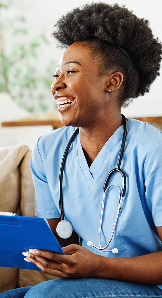 Smiling nurse with a stethoscope and clipboard
