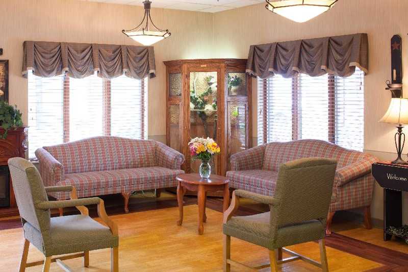 Cozy common area with comfortable seating and flowers