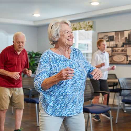 Residents participating in a joyous exercise class