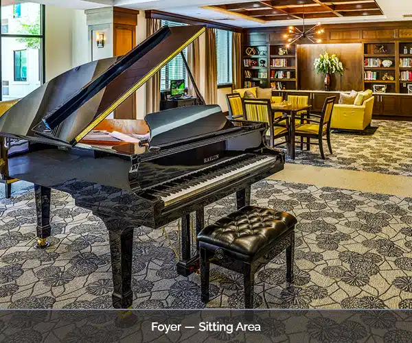 Interior sitting area with a grand piano and seating
