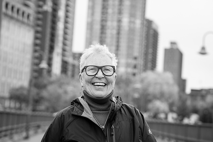 Smiling senior woman on an outdoor bridge