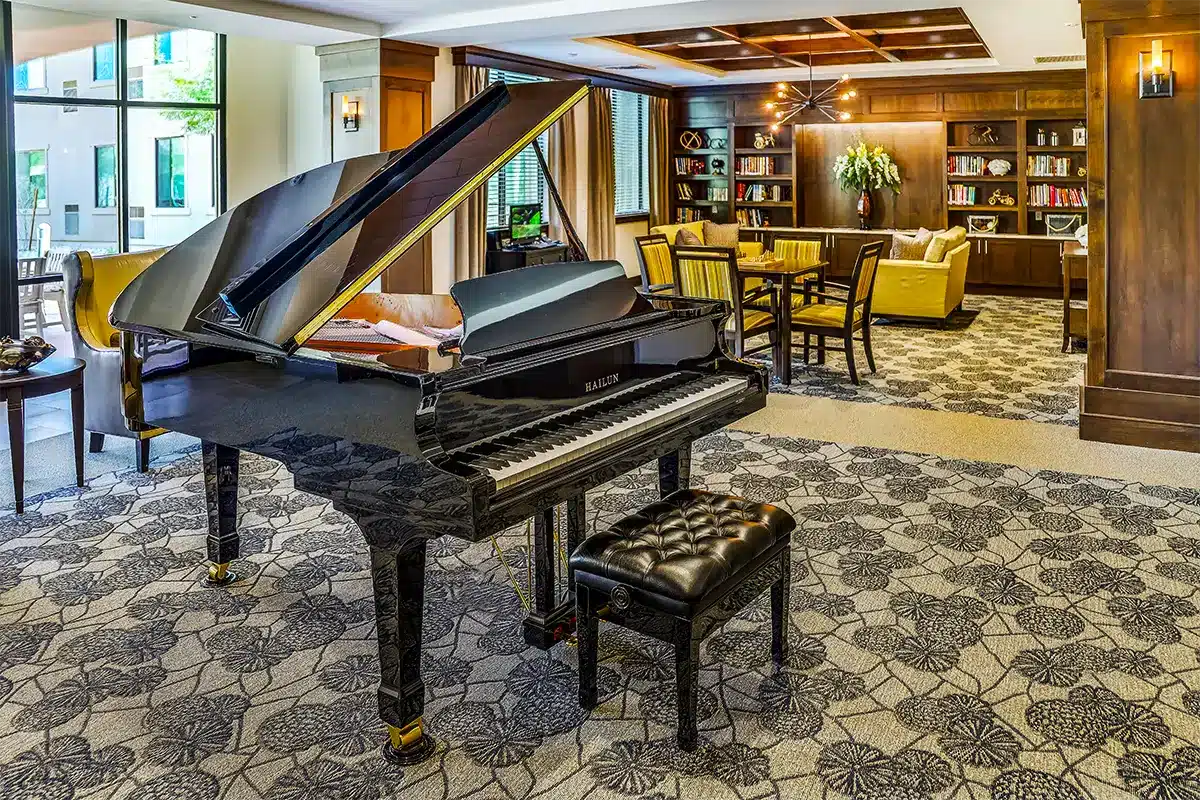 Interior common area with a grand piano and seating