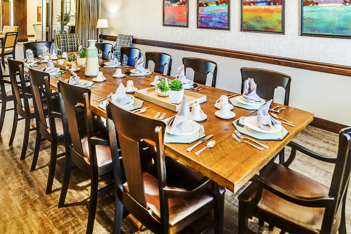 Dining area set up for a meal with decorative table settings