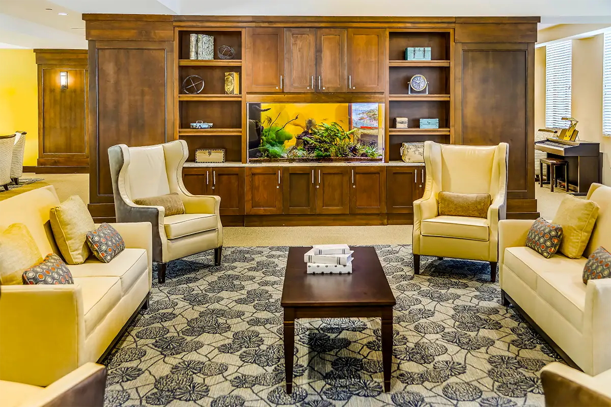 Comfortable common area with seating and an aquarium