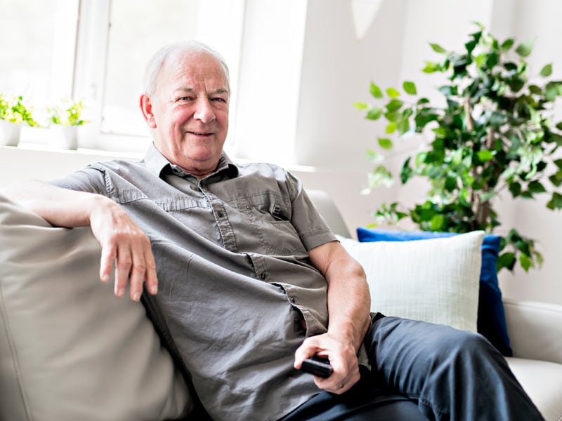 A resident enjoying leisure time in a common area