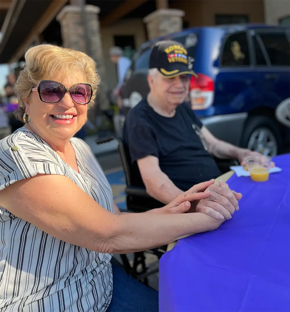 Residents enjoying a sunny day outdoors at an event