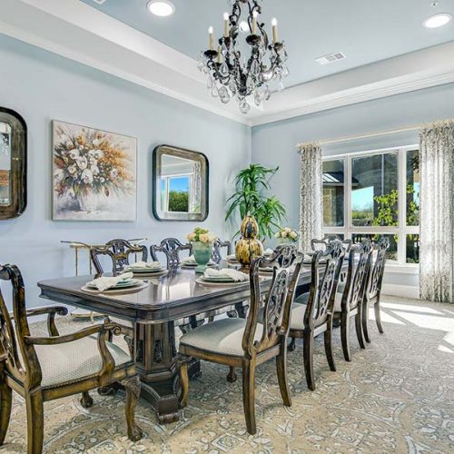 Elegant dining room with a large table and chandelier