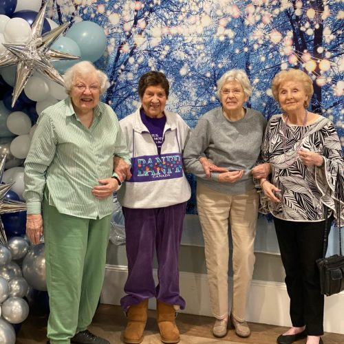 Residents posing together at a celebration.