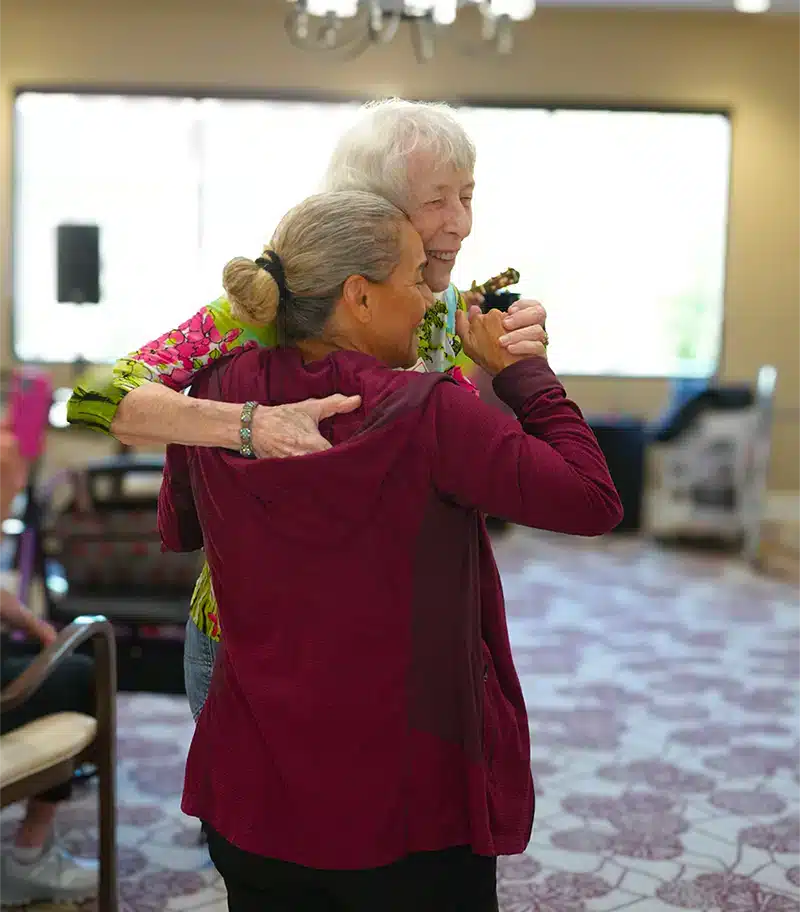 Residents enjoying a dance in the common area