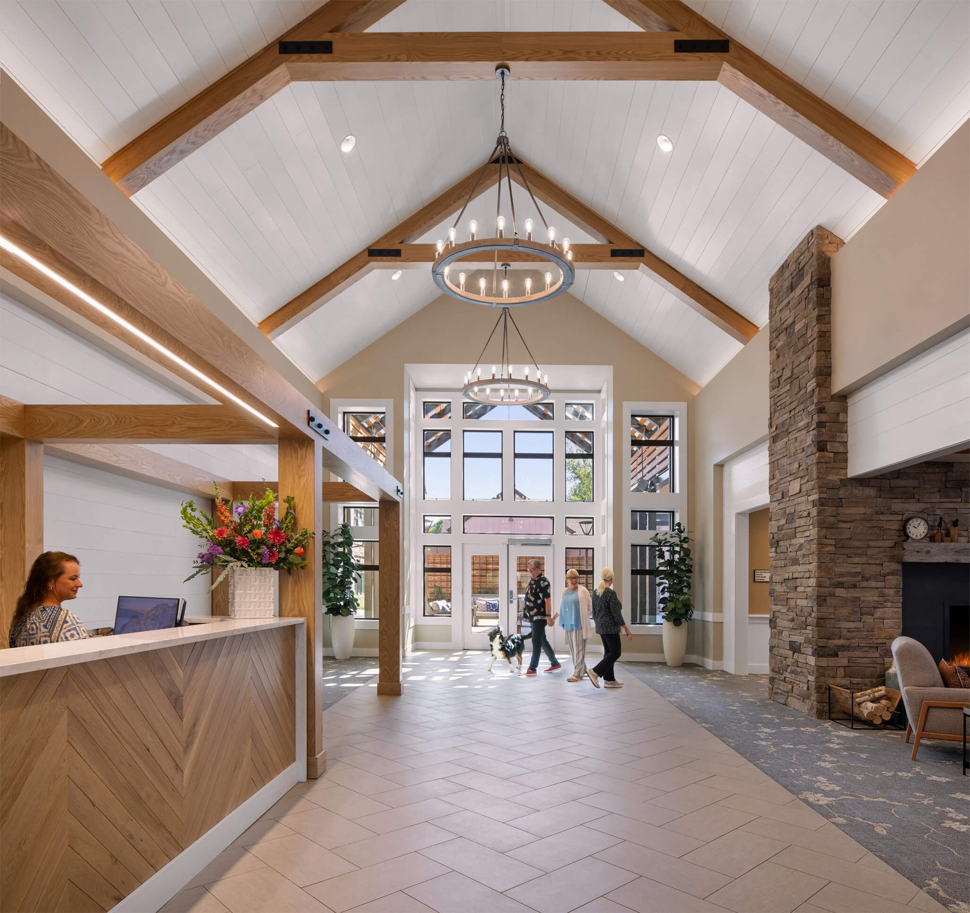 Bright lobby with staff and residents interacting