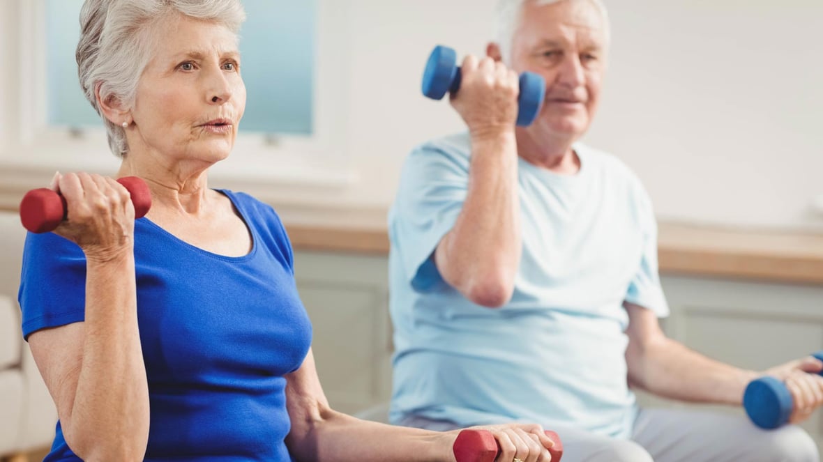 Residents participating in an exercise activity with weights