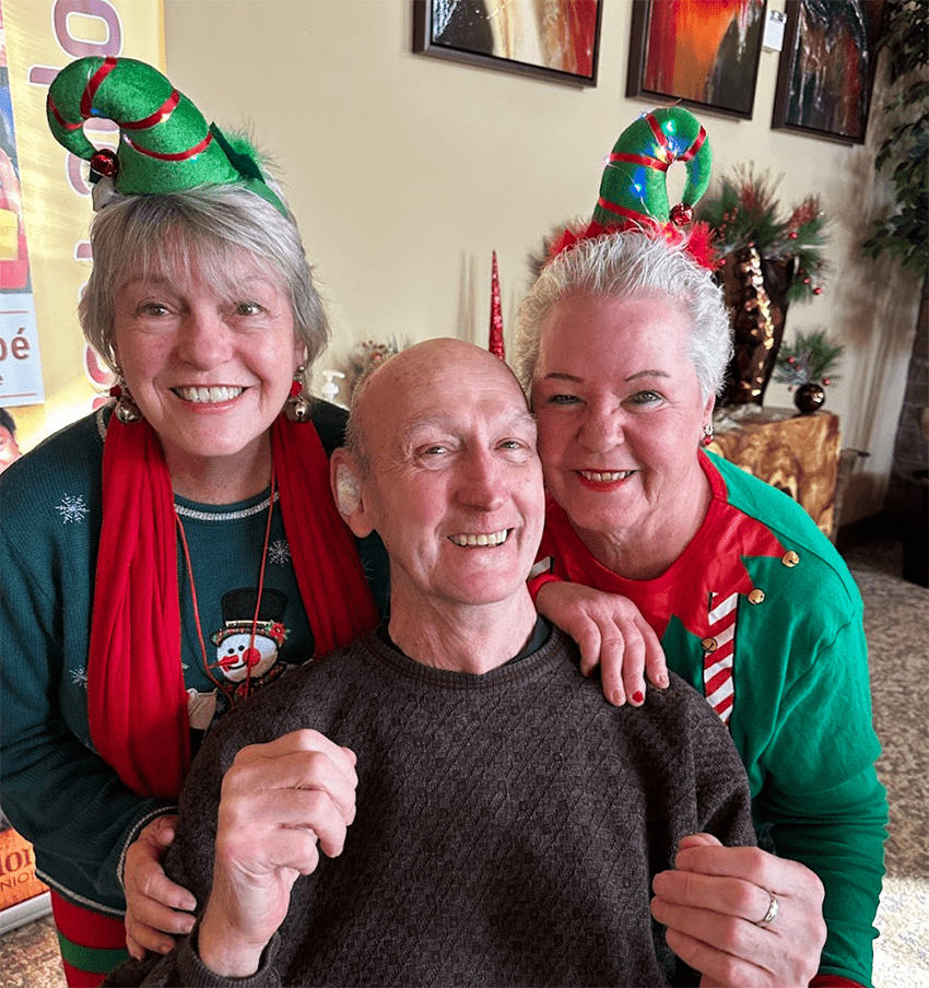 Residents celebrating with staff during a festive event