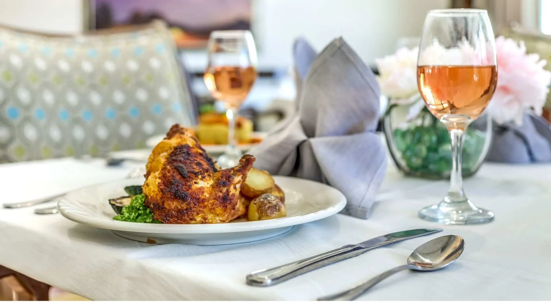 A beautifully plated meal with wine on a dining table