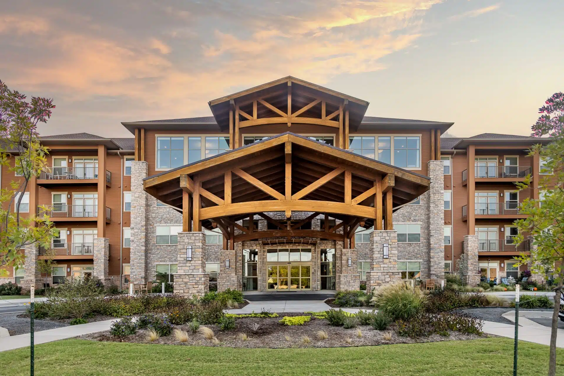 Exterior view of Legacy Retirement Residence building at sunset