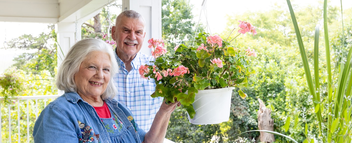 Residents enjoying gardening on a sunny porch