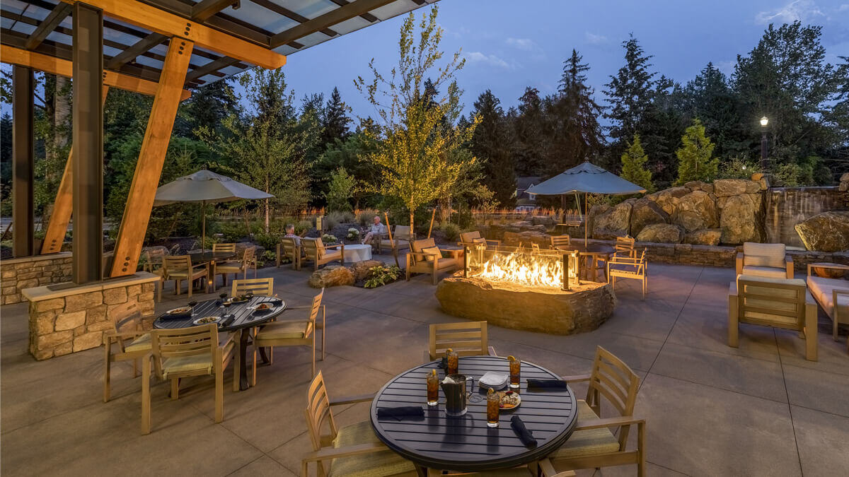 Outdoor dining area with a fire pit and seating