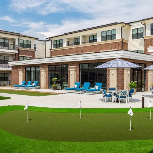 Outdoor area with seating and putting green