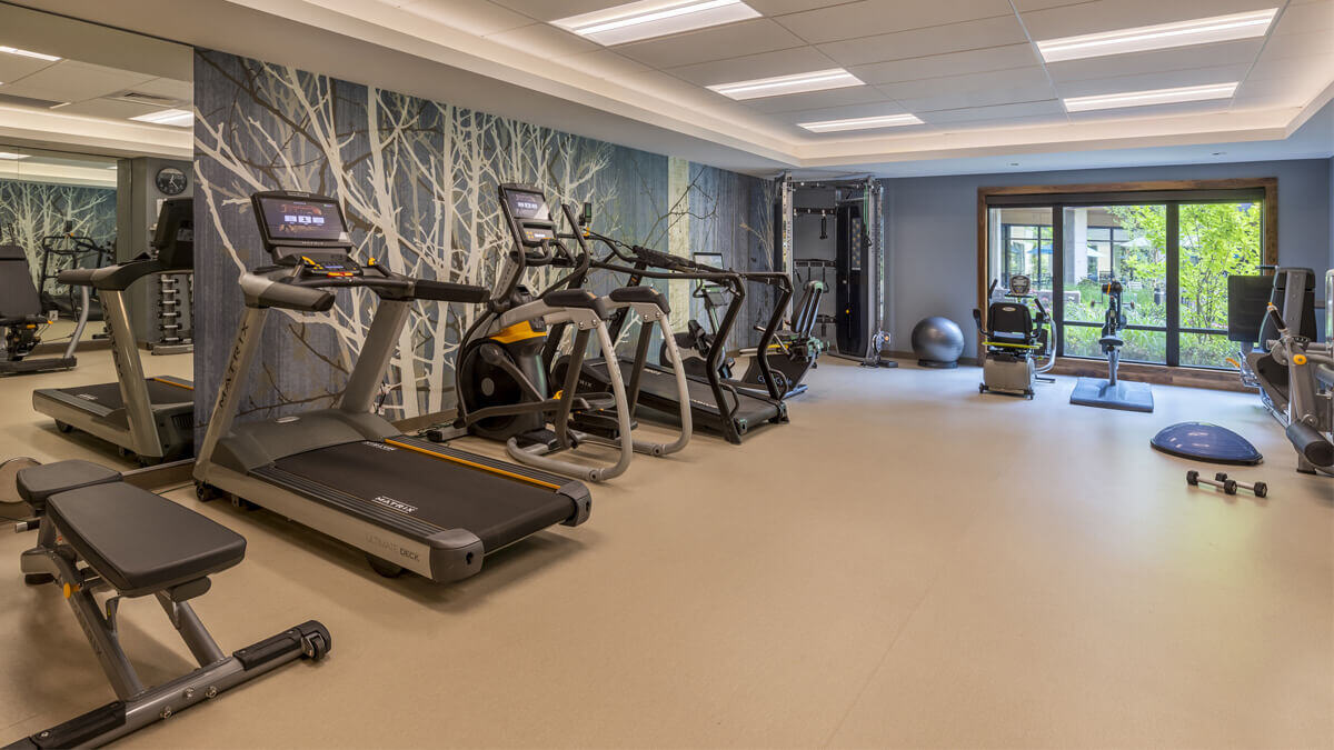 A well-equipped exercise room with multiple machines