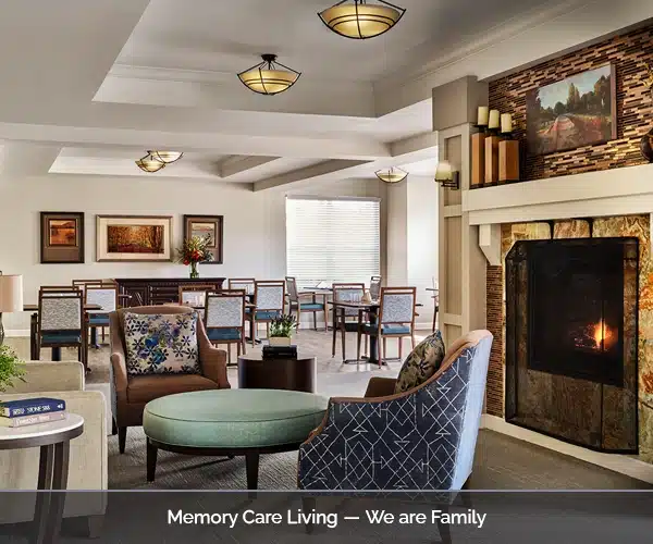 Bright common area with seating and fireplace