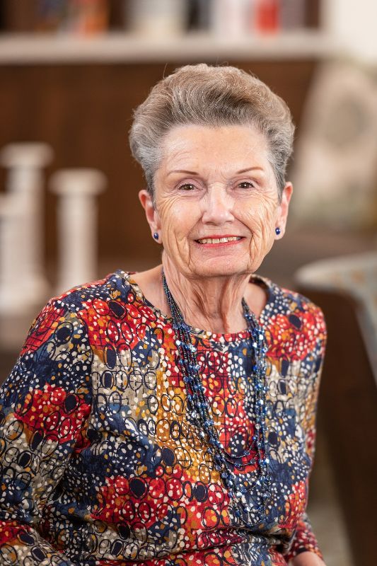 Senior resident smiling in a common area