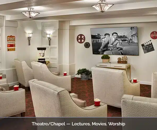 Theatre/church area with comfortable seating and a large screen