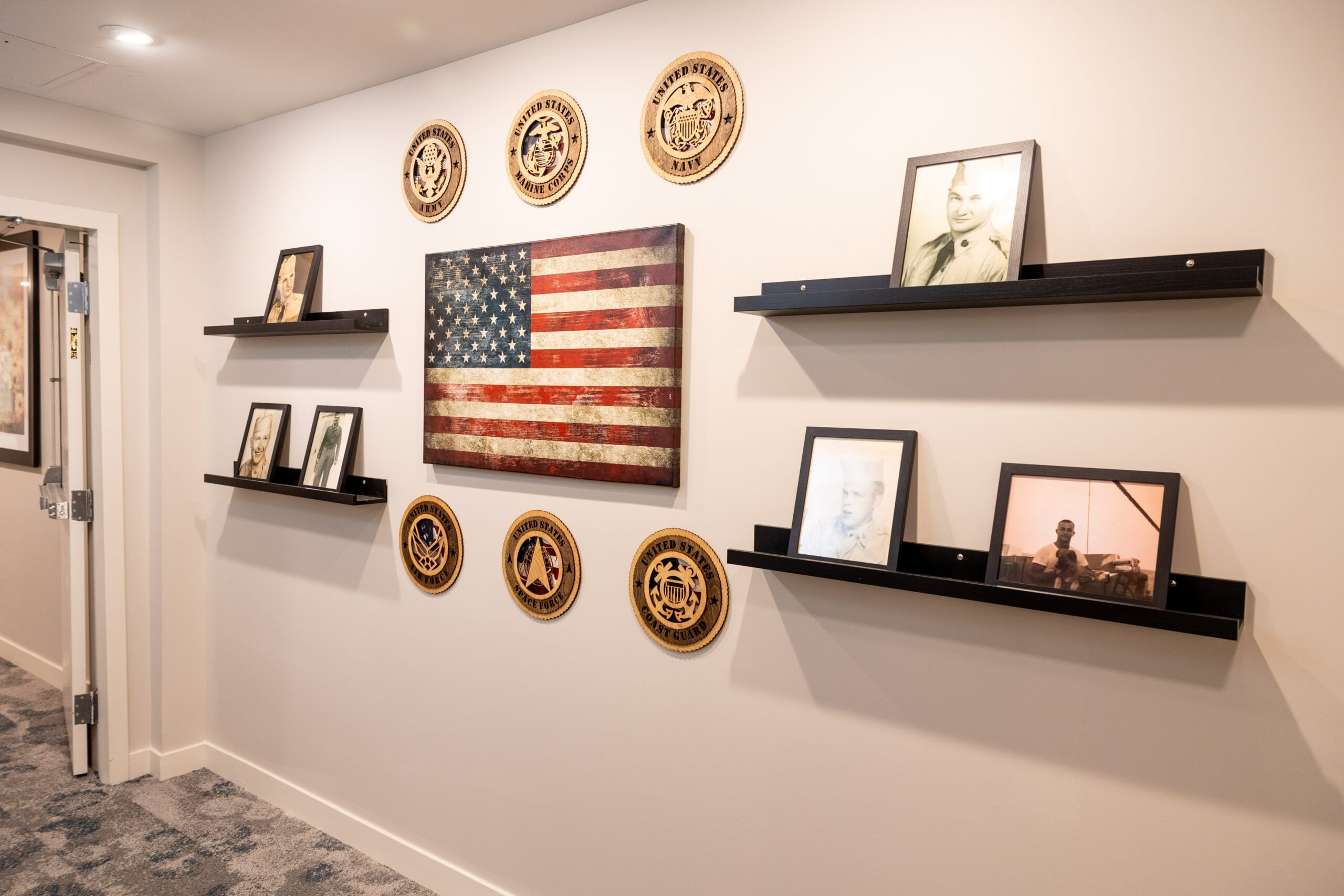 Decorative wall with an American flag and historical photos