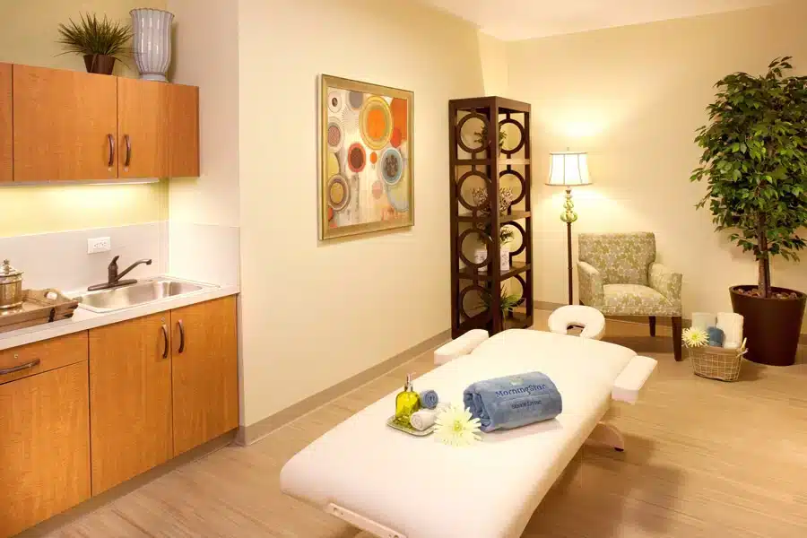 Spa-like treatment room with calming decor and amenities