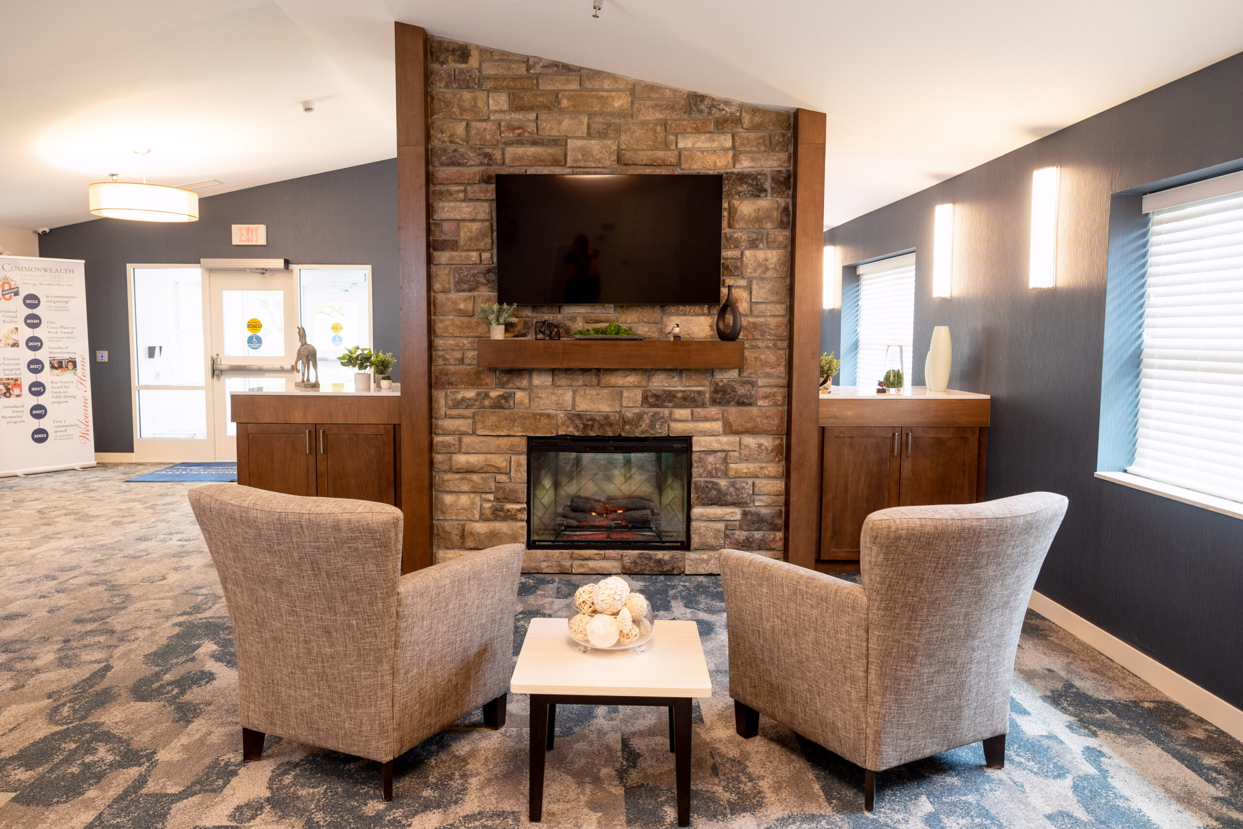 Cozy common area with seating and fireplace