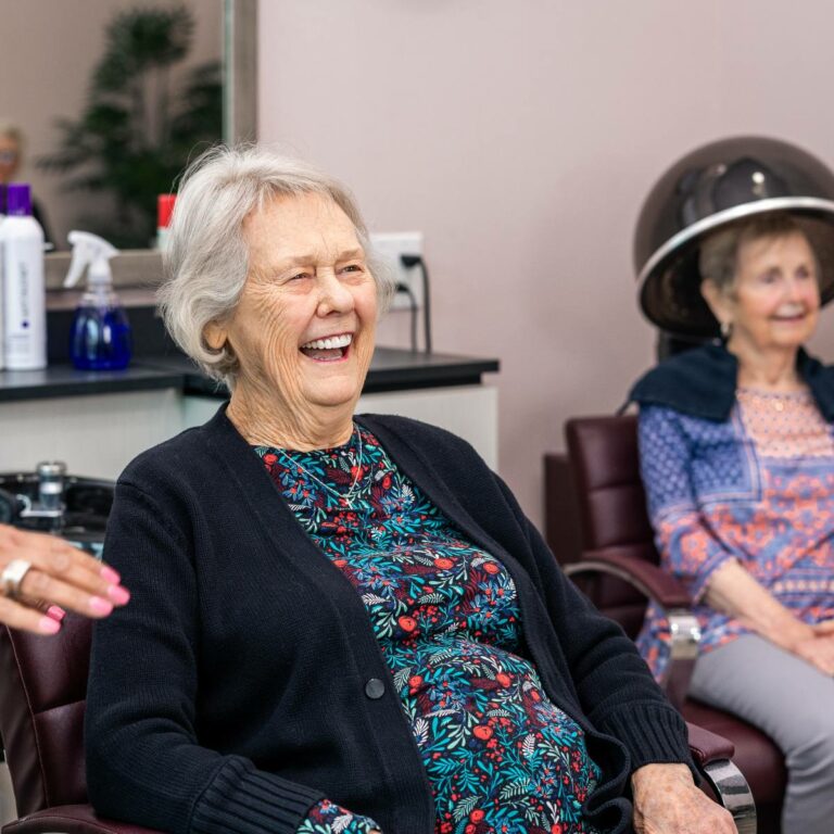 Residents enjoying a hair salon activity