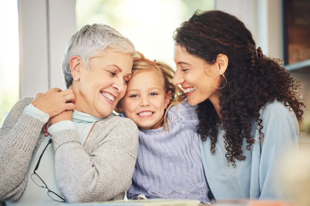 Three generations smiling together in a warm interaction