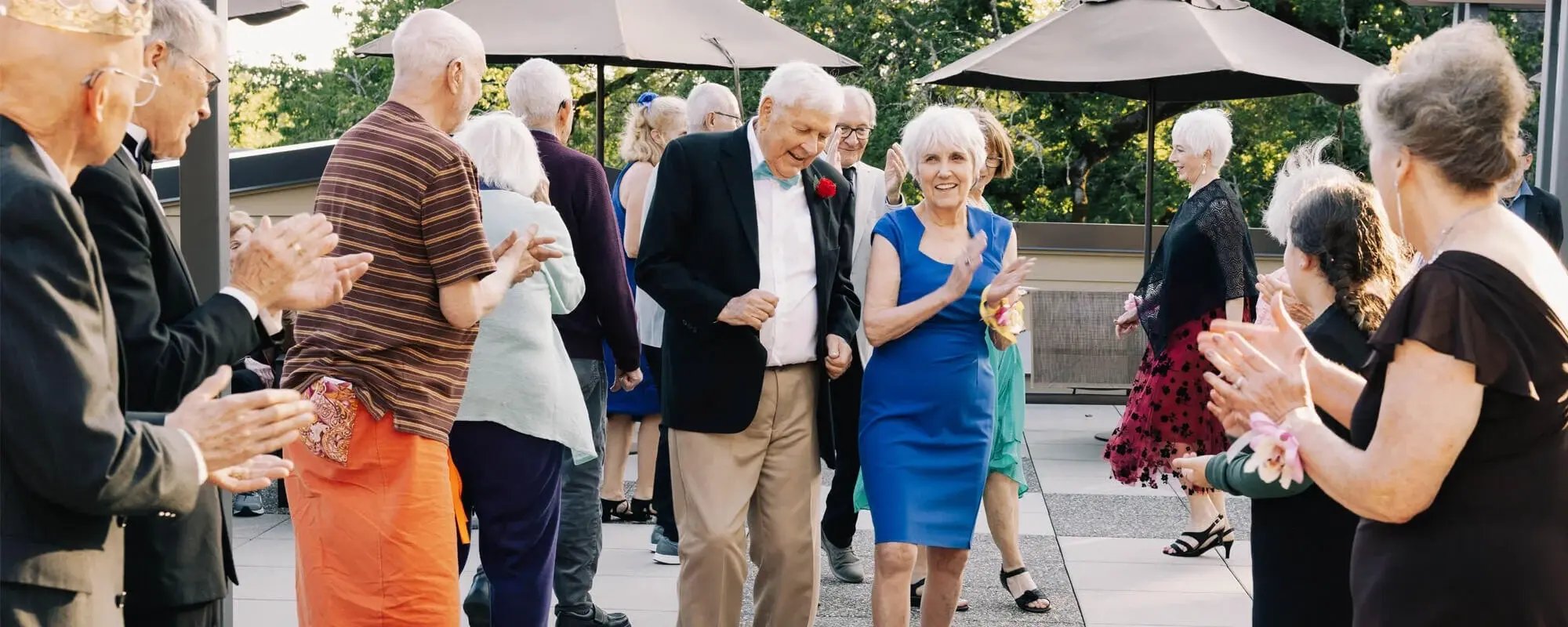 Residents enjoying a lively dance on the outdoor patio