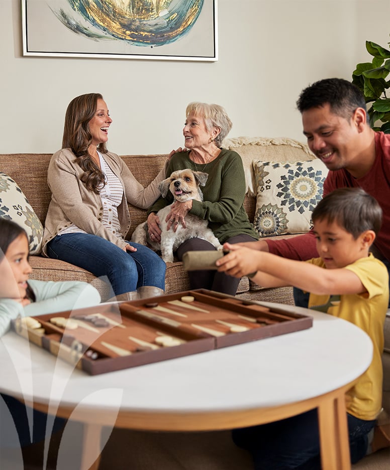 Residents and staff interacting in a cozy common area