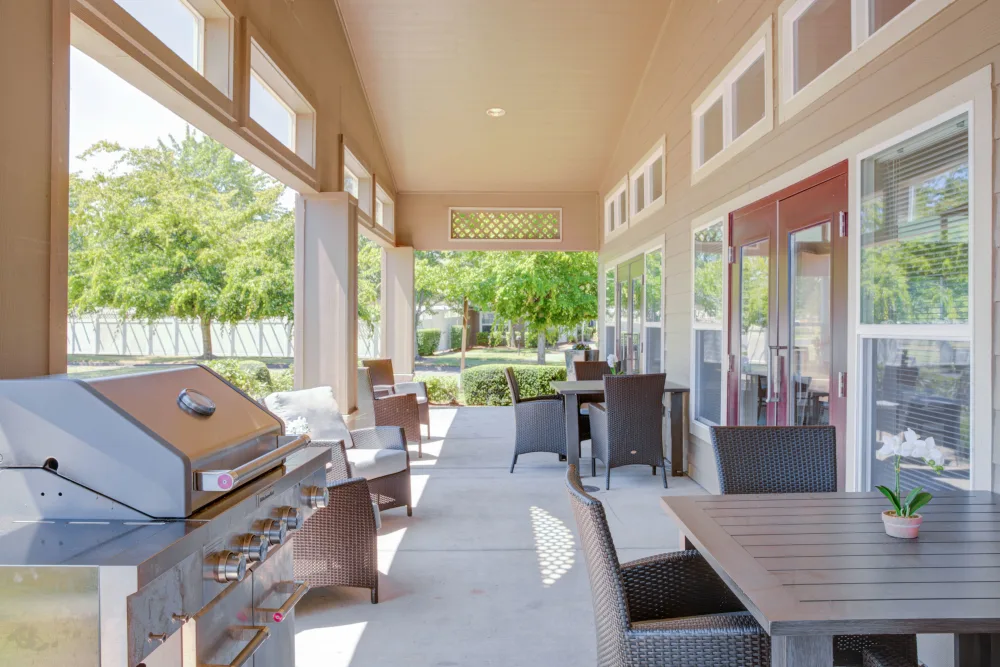 Patio area with outdoor seating and grill station