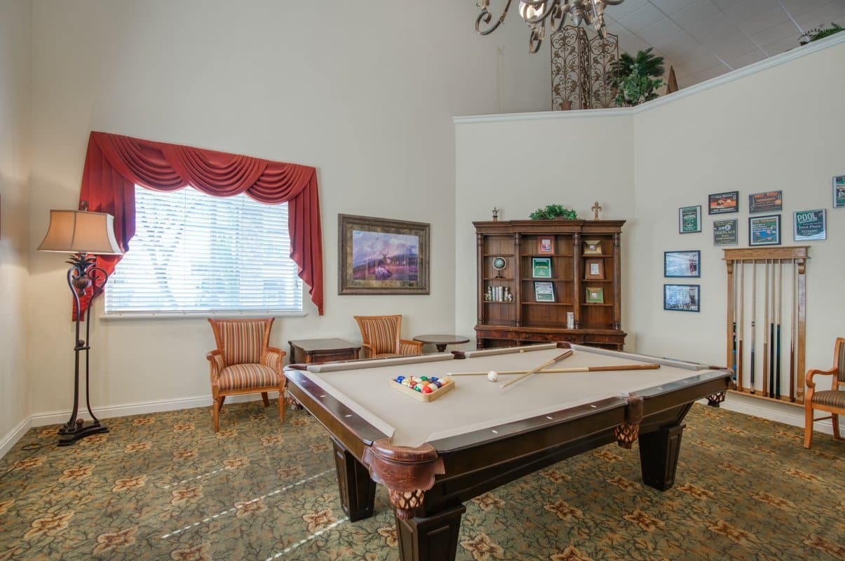Common area with a pool table and seating