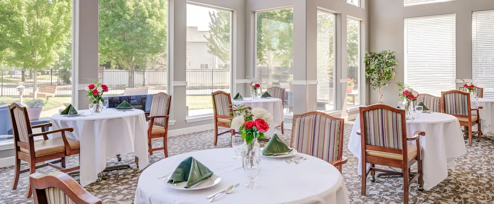 Bright dining room with tables set for a meal