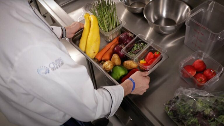 Chef preparing fresh vegetables in a kitchen