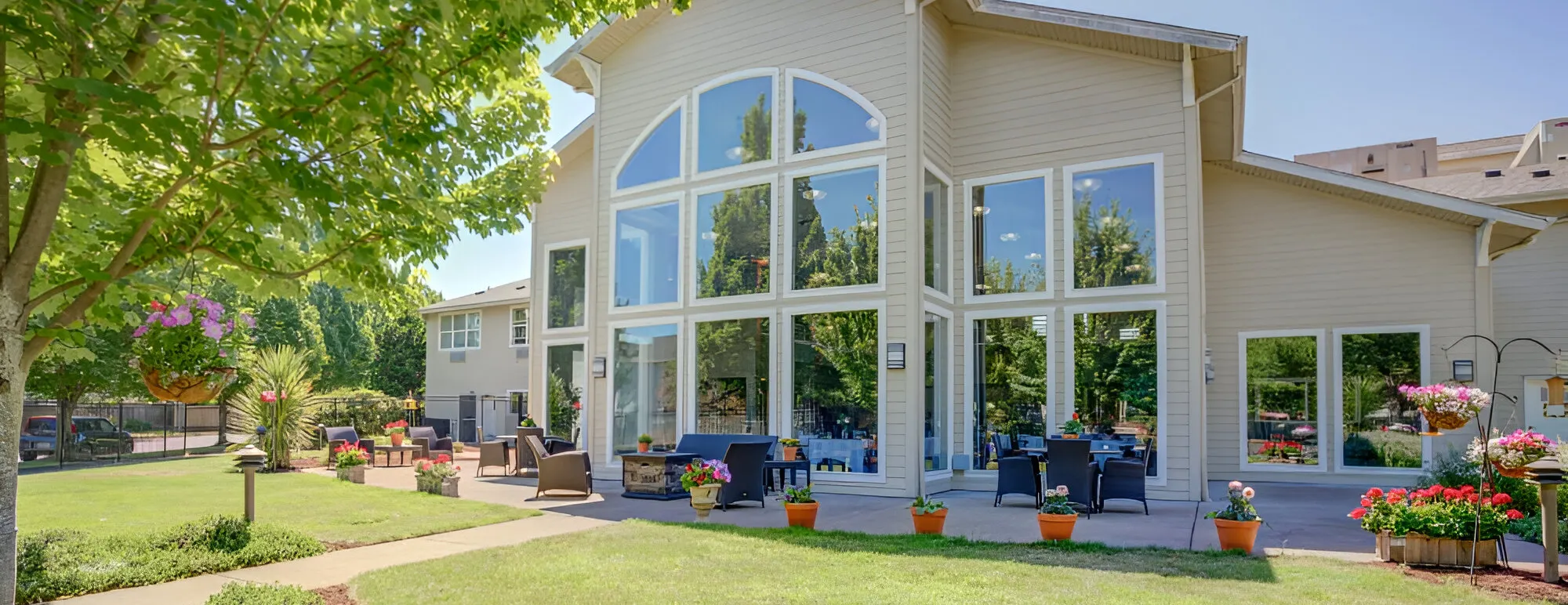 Exterior view of Evergreen Senior Living with outdoor seating area