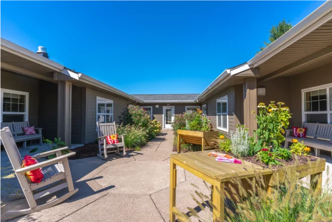 Outdoor courtyard with benches and flowers