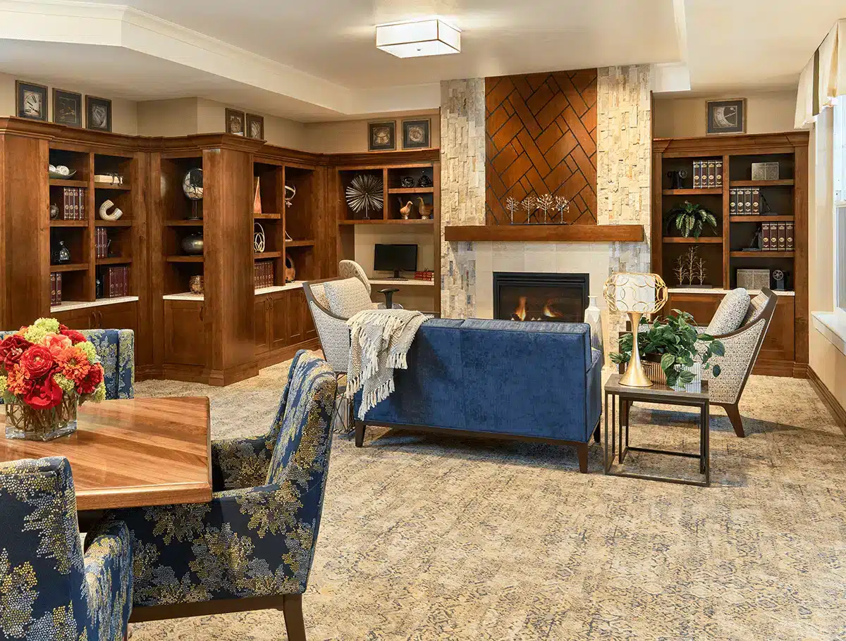 Cozy common area with comfortable seating and bookshelves